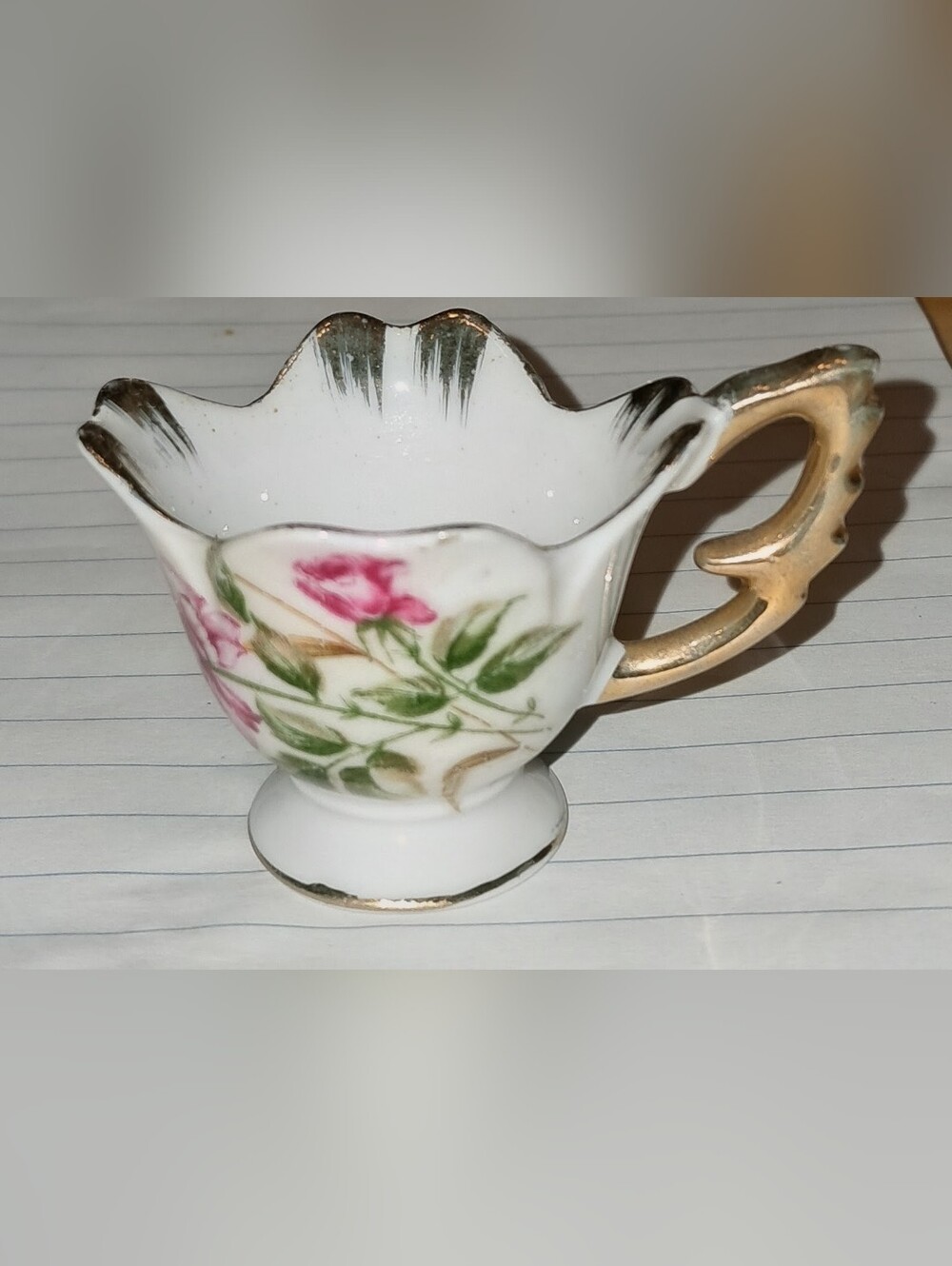 TEA CUP MINIATURE PORCELAIN FLORAL GILDED RIM AND HANDLE